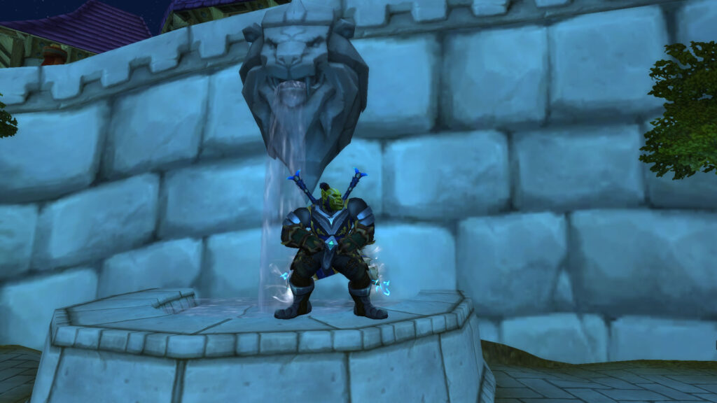WoW an orc warrior flaunts near a fountain with a lion in stormwind-city